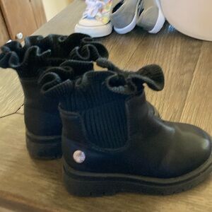 Black ankle booties with ruffle detail